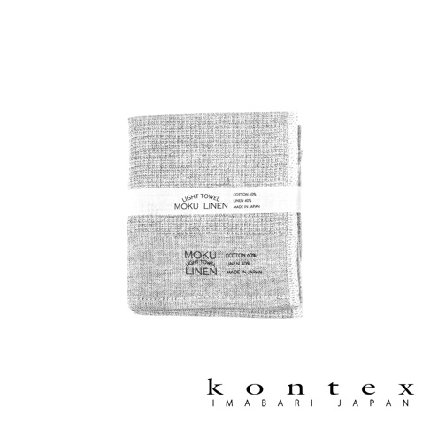 MOKU LINEN 輕薄速乾拭巾，淺灰色，棉 60%、麻 40% 材質，織有清晰的紋理，並帶有產品資訊標籤。