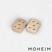 兩件石白色陶製傘架，每件皆有五個圓孔，設計簡約，適合收納雨傘。