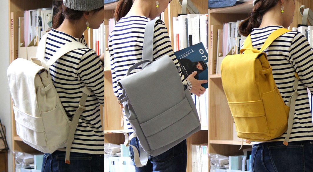 loiter高島帆布前蓋式背包，提供米白色、灰色、芥末黃三種顏色選擇，材質為帆布，設計簡潔，前蓋式翻口，兩側有口袋。