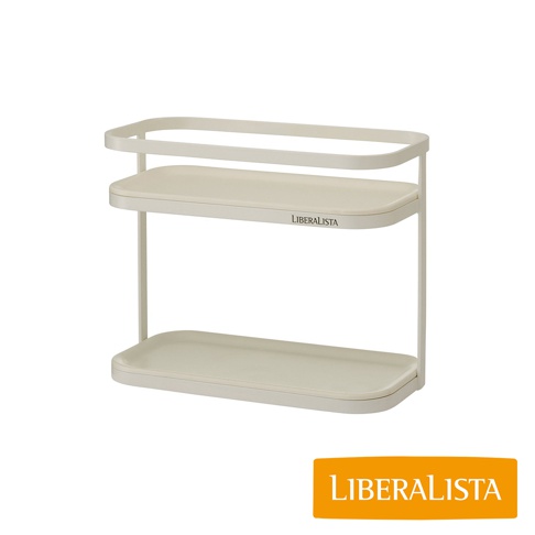 LIBERALISTA 品牌象牙白色兩層置物架，上方有網狀邊框，中間層有 LIBERALISTA 品牌字樣。