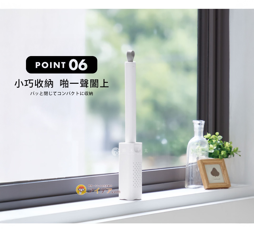 白色推拉式海綿清潔刷，帶有灰色頂部握把，置於窗台上。