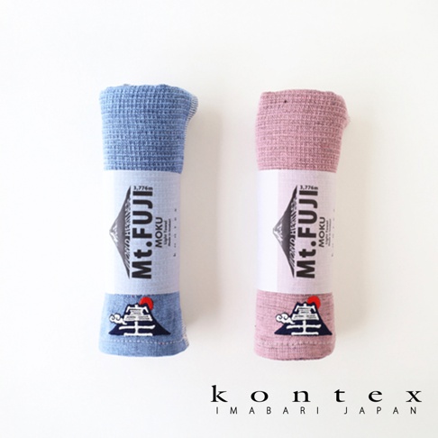 兩條 Mt.FUJI MOKU 超速乾輕薄吸水長毛巾，一條為淺藍色，另一條為粉紅色。兩條毛巾均採用輕薄材質，並帶有富士山圖案和品牌標誌。