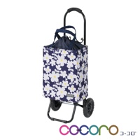 深藍色提袋購物車，印有白色小花和黃色花蕊圖案，配有黑色金屬車架、黑色提把和兩個黑色輪子。