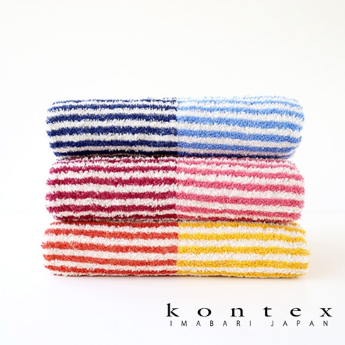 三條疊放的 KONTEX 今治迷你浴巾，由上至下依序為深藍搭配淺藍、深粉搭配淺粉、以及橘色搭配黃色的雙色條紋設計，毛巾表面具有細緻的棉麻紋理，下方印有 kontex IMABARI JAPAN 品牌標誌。