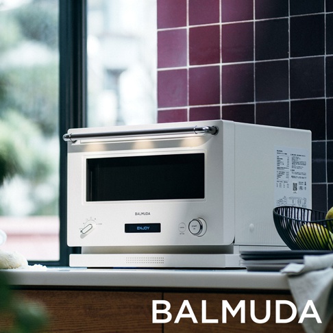 The Range 20L 微波烤箱，白色，配備銀色提把，正面有黑色觸控螢幕顯示「ENJOY」，旋鈕控制，以及圓形啟動按鈕。