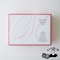 Colombin Merveille 綜合巧克力夾心餅乾禮盒，粉色外盒印有大寫 M 字樣與品牌標誌