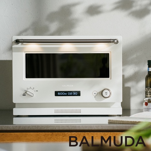 The Range 20L微波烤箱，白色，配有銀色金屬把手和LED顯示屏，顯示600W 02:30。產品右側有旋鈕和按鈕，下方有散熱孔。