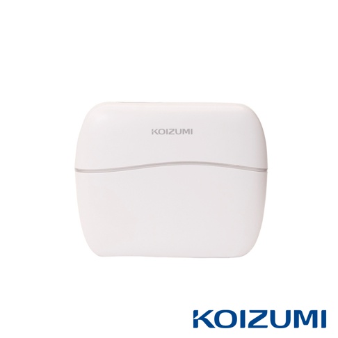 這是一個純白色的 KOIZUMI 品牌小型電器，外觀呈簡約圓潤的方形盒狀，正面中央印有灰色 KOIZUMI 字樣，上方有一條水平線條裝飾，下方則同樣標示著藍色的 KOIZUMI 品牌標誌。
