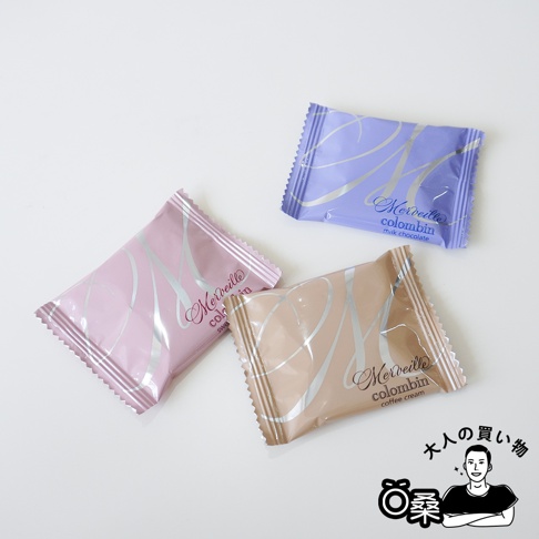 三款 Merveille Colombin 巧克力包裝，分別是粉紅色、米褐色和淡紫色，上面印有品牌的標誌和口味名稱。