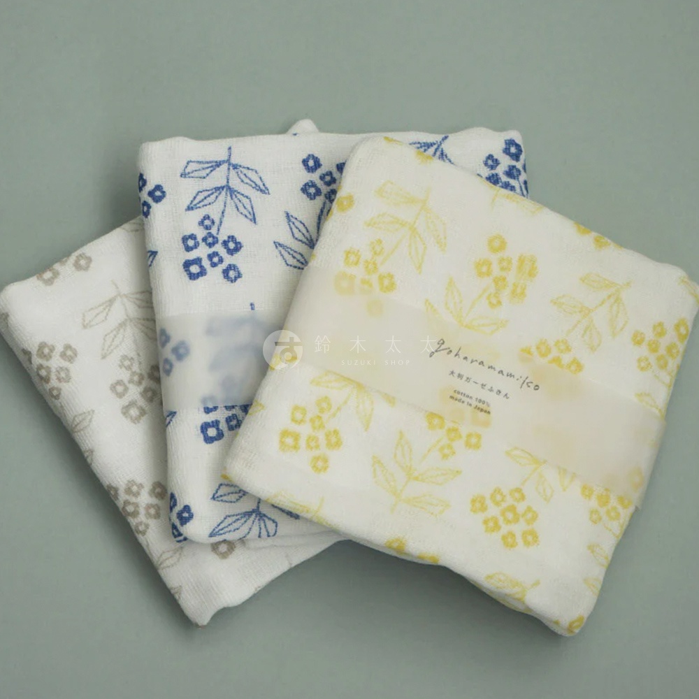 三條純棉花草紗布大拭巾，分別印有灰色、藍色及黃色花草圖案。