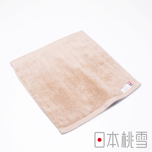 淺米色今治超長棉方巾，質地柔軟，邊緣有織紋，角落處有品牌標籤。
