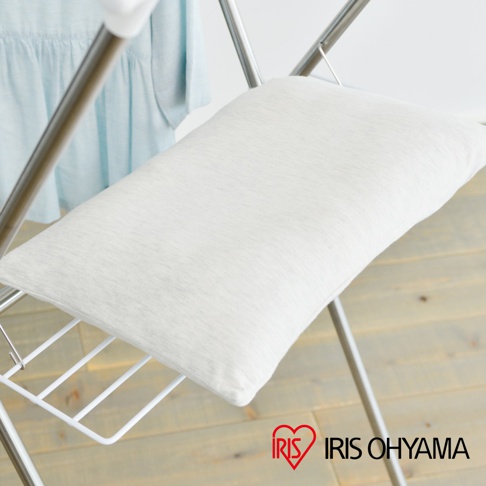 隨插即用便利曬衣架 H-70XN，展示一個置於銀色金屬曬衣架上的白色軟墊，軟墊材質為織布，表面有細緻紋理。