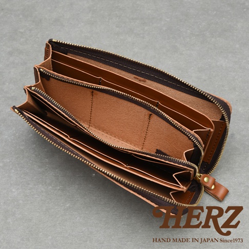 職人手作皮革Organ大容量拉鍊長夾 GS-68，打開展示內部多層隔間與卡槽，採用棕色皮革與深棕色拉鍊，整體風格簡約實用。