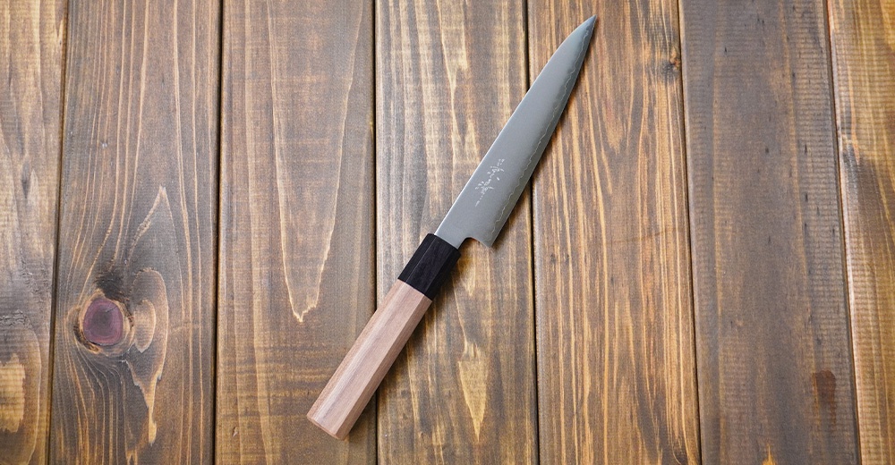 [景清] Chromax鋼水果刀，15公分長，配有木質手柄，刀身為銀色鋼材，手柄連接處有黑色裝飾。