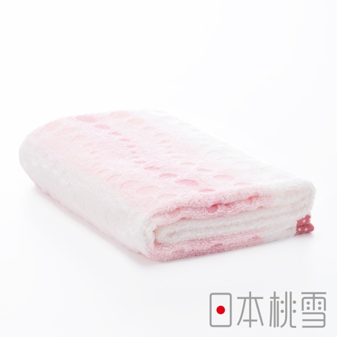 今治水泡泡浴巾，粉白色漸層，織有圓形泡泡圖案，材質柔軟。