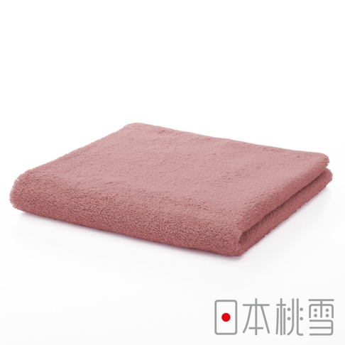 粉紅色精梳棉飯店毛巾，材質柔軟，觸感細緻，邊緣有流蘇設計。