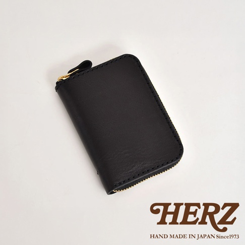 職人手作黑色皮革多用途收納鑰匙包，拉鍊開合，金色拉鍊頭，簡約設計，適合隨身攜帶。