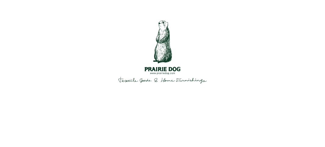 綠色線條繪製的草原犬鼠站立圖案，下方為「PRAIRIE DOG」品牌名稱、網址及「Textile Goods & Home Furnishings」字樣。