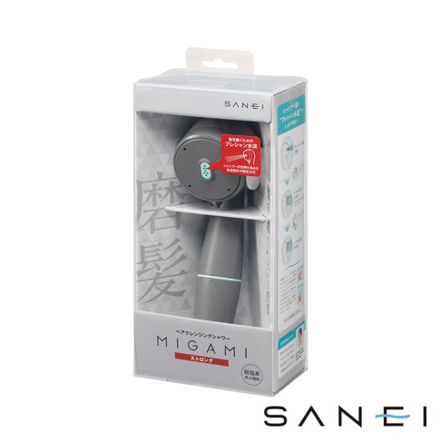 MIGAMI 兩段式水流專髮按摩蓮蓬頭（強勁款）的灰色包裝盒，內含同款灰色的蓮蓬頭，蓮蓬頭有圓形噴頭和橢圓形手柄。