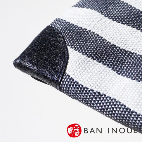 BAN INOUE 品牌標誌和斑馬紋理斜背包特寫