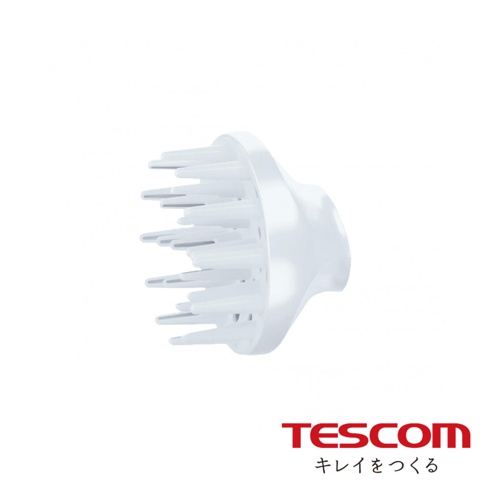 TESCOM 品牌標誌，下方為日文「キレイをつくる」，以及一個白色的吹風機烘罩配件，配件前端有許多細長的白色梳齒，後端與吹風機結合處為白色圓弧形設計。