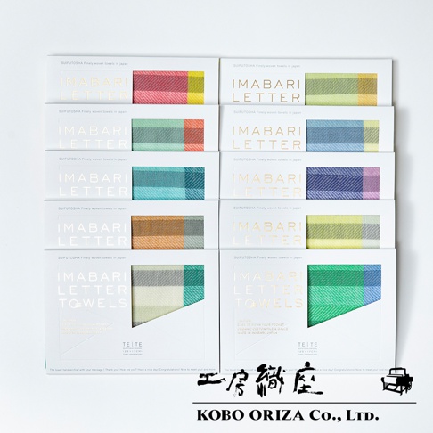 TETE 今治格紋信封式長方形手帕，展示了多種柔和色調的格紋設計，包括粉紅色、綠色、藍色、橘色和紫色等。手帕採用精細織法，材質應為棉，呈現細膩的紋理。